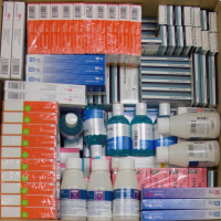 A picture from above of lots of boxes and bottles of different medicines.